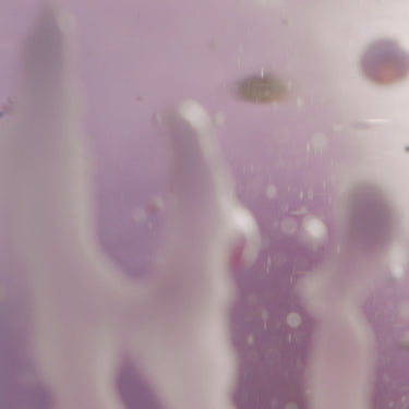 Pink globs in a glass.